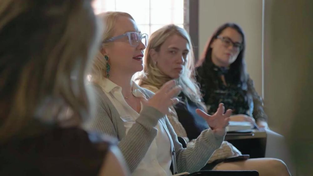 Guests in discussion at a workshop table