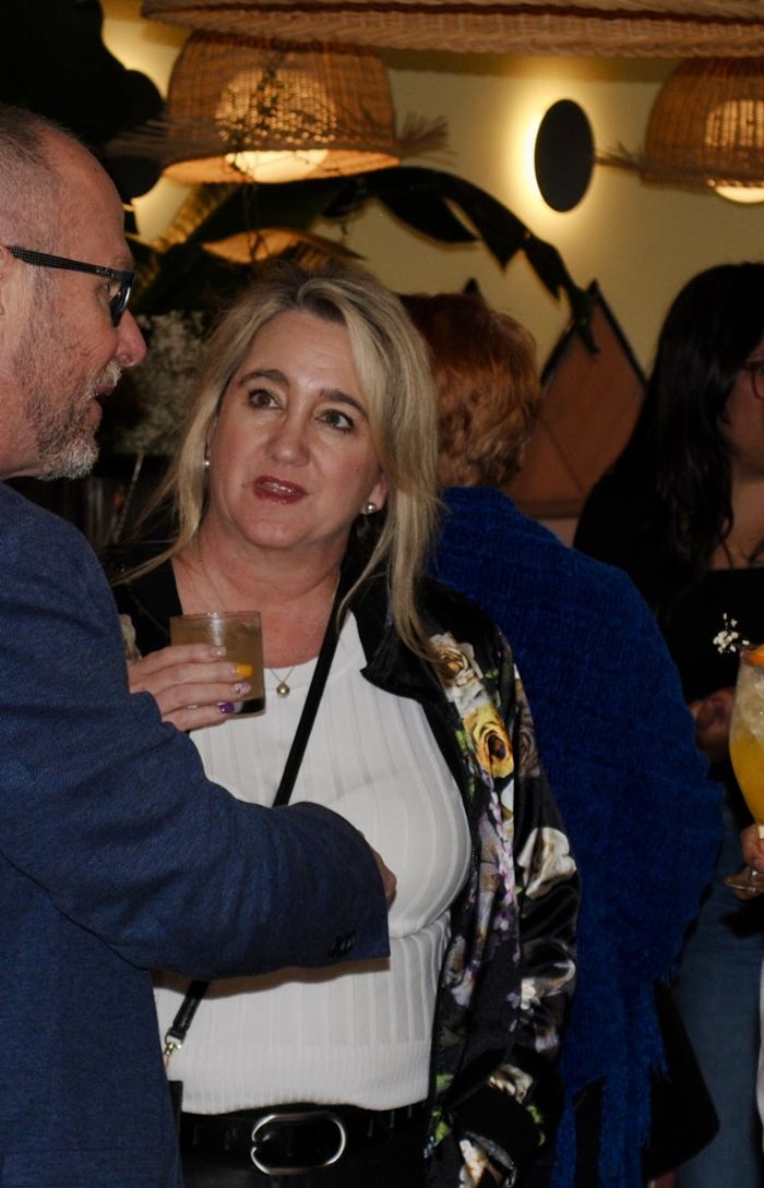 Guests in conversation over drinks at Lolita's