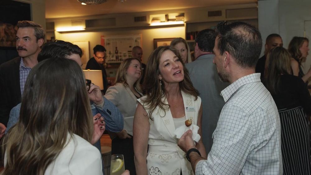 Guests talking at the welcome reception